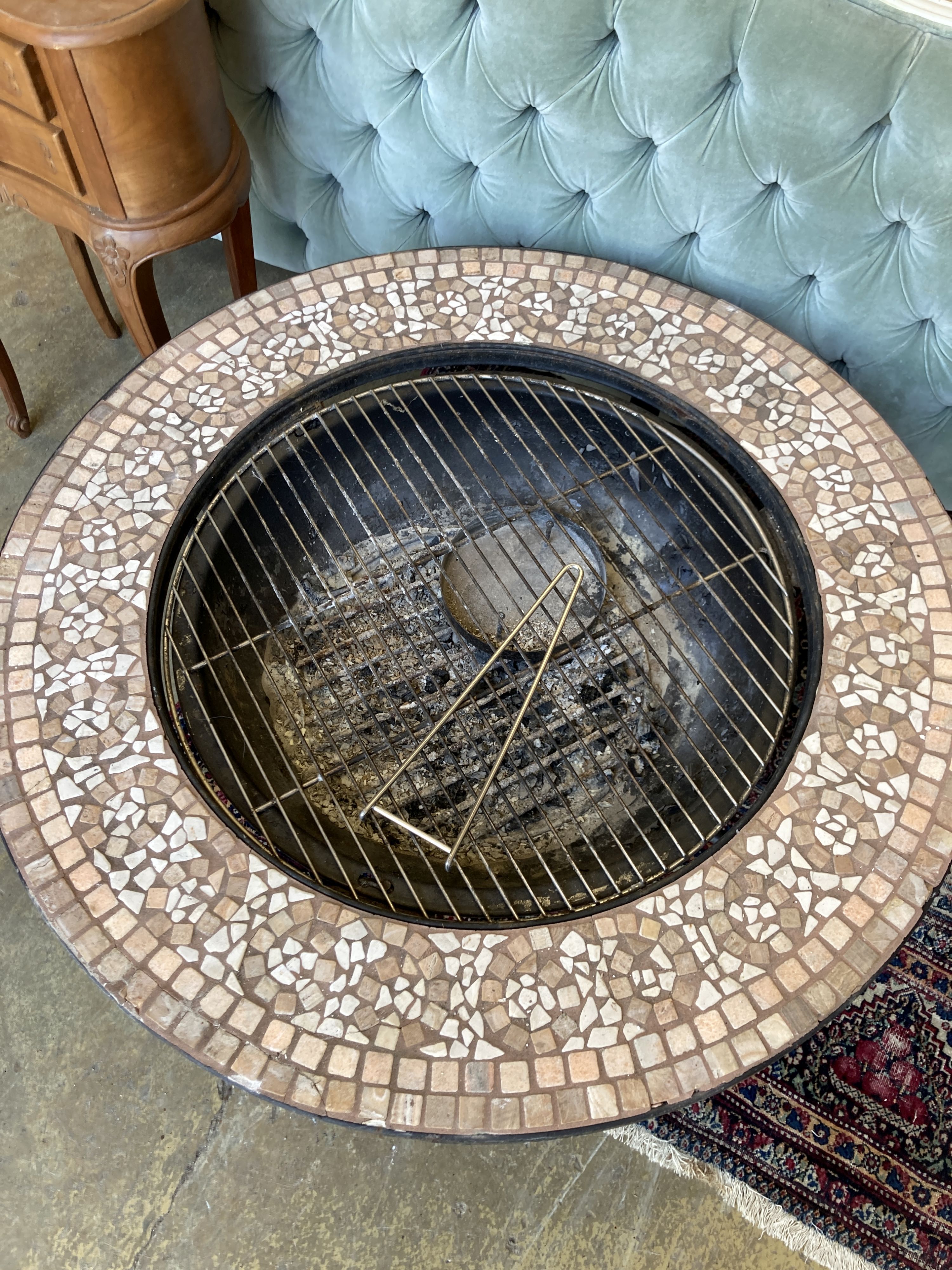 A mosaic top firepit